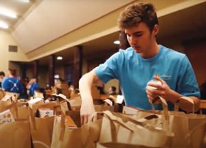 A person organizes gift bags