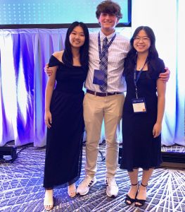 Three students in formal attire