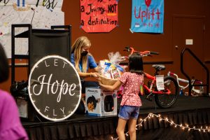 A child receives a large gift basket