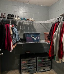 a photo of a closet with clothes