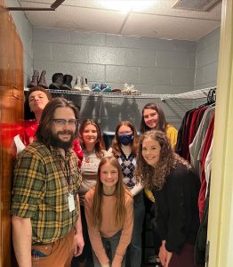 a photo with students standing in a closet